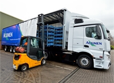 fork lift moving cargo into one of Acumen Logistics distribution lorries.