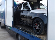 close up view of a car inside an Acumen Logistics covered car transport lorry