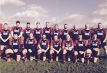 picture of the Pinley Rugby Football Club team on a rugby pitch near the goal